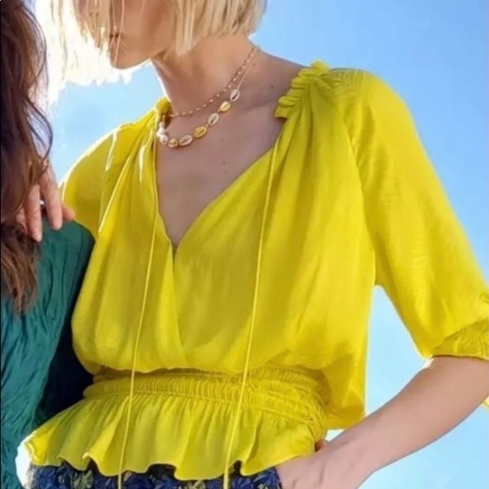 Anthropologie Current Air small bright yellow blouse with billowy sleeves.